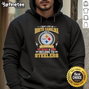 Cozy hoodie featuring 'I live in North Carolina but my heart belongs to Steelers' design, perfect for Pittsburgh Steelers fans.