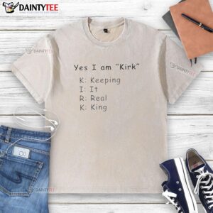 Hot Yes I Am Kirk Keeping It Real King washed t-shirt displayed on a hanger, showcasing its stylish design and vibrant colors.
