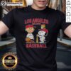 Alt Text: Charlie Brown, Snoopy, and Woodstock wearing LA Angels baseball jersey Est 1961 on a fun graphic t-shirt.