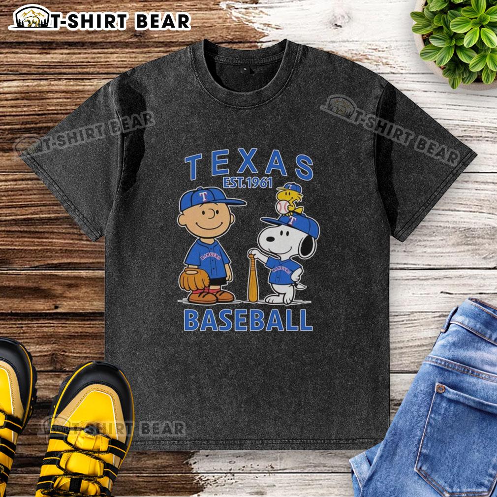 Good Charlie Brown Snoopy And Woodstock With Texas Rangers Baseball Jersey Est 1961 Washed T-Shirt Alt Text: Good Charlie Brown, Snoopy, and Woodstock wearing Texas Rangers baseball jersey, Est. 1961 on a washed t-shirt.