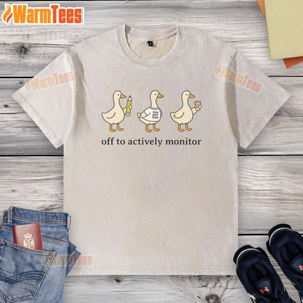 good-off-to-actively-monitor-teacher-testing-test-day-goose-washed-t-shirt Teacher wearing a 'Good Off To Actively Monitor' washed t-shirt on test day, ready for student testing supervision.