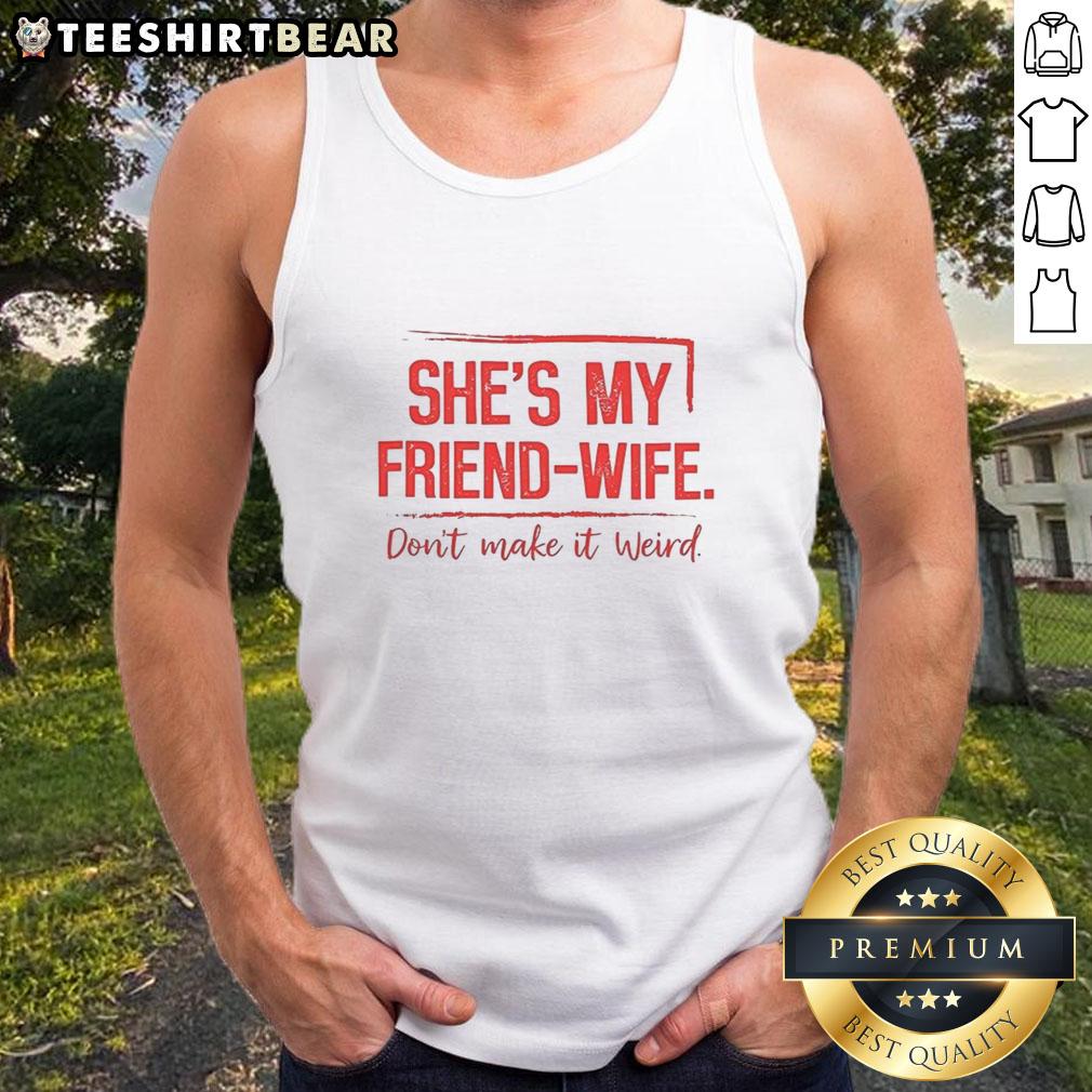 good-shes-my-friend-wife-dont-make-it-weird-tank-top Alt Text: Woman wearing a Good Shes My Friend Wife Don't Make It Weird tank top, smiling outdoors in a casual setting.