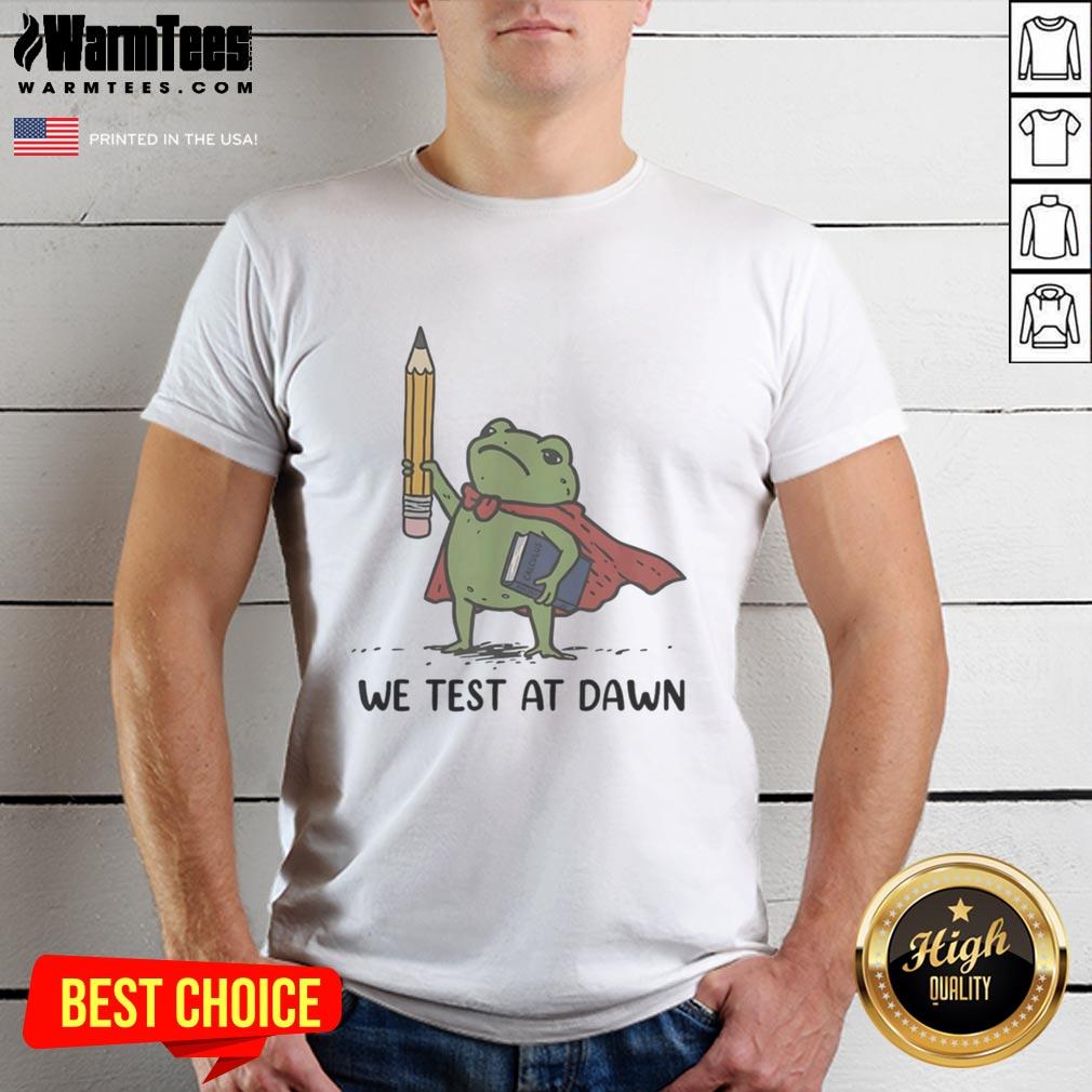 good-teacher-frog-holding-giant-pencil-and-calculus-boook-we-test-at-dawn-t-shirt-1 Alt Text: Good Teacher Frog holding a giant pencil and calculus book on a 'We Test at Dawn' T-shirt design