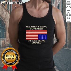 Awesome We Aren't Being Governed We Are Being Looted tank top design featuring bold text on a stylish apparel background.