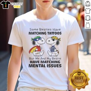 Alt Text: Cute Snoopy T-shirt featuring a humorous quote about matching mental issues among best friends and their tattoos.