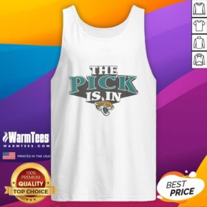 Alt Text: Hot Jacksonville Jaguars fan wearing a tank top celebrates after the team's pick is in during the NFL draft.