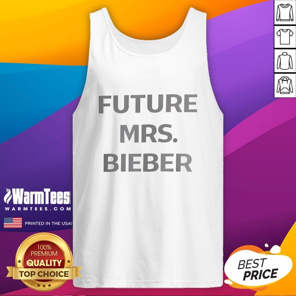 hot-future-mrs-bieber-coachella-tank-top Young woman wearing a 'Hot Future Mrs. Bieber' Coachella tank top, enjoying a vibrant festival atmosphere.