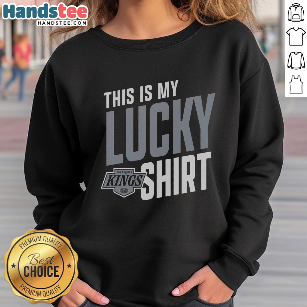 hot-los-angeles-kings-this-is-my-lucky-sweatshirt Person wearing a lucky sweatshirt while cheering for the Los Angeles Kings at a hockey game in vibrant colors.