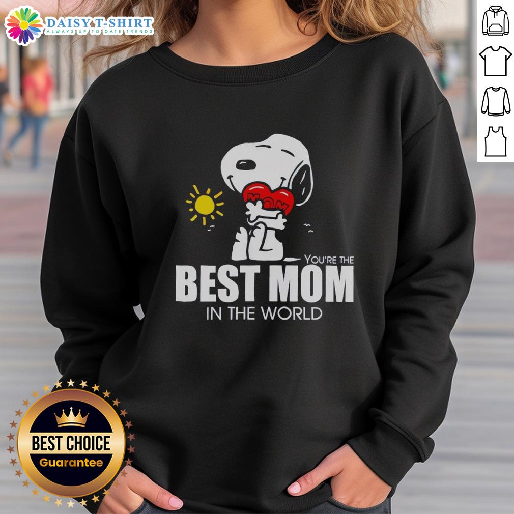 Hot Snoopy Hugging Heart Best Mom In The World Sweatshirt Hot Snoopy hugging a heart on a cozy sweatshirt, perfect gift for the best mom in the world.