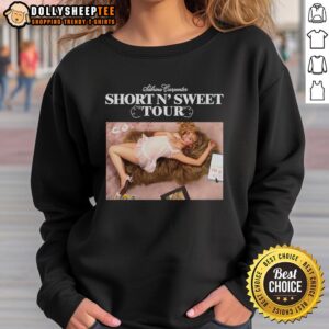 Alt Text: Sabrina Carpenter wearing the Original Short N Sweet Tour sweatshirt, showcasing a stylish and cozy concert look.