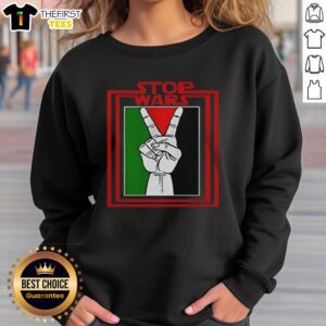 Top Stop Wars Free Palestine sweatshirt design featuring bold text and a graphic symbol of peace.