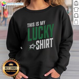 Fan wearing a lucky sweatshirt featuring Dallas Stars logo at a game, showcasing team spirit and style.