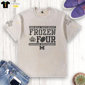 Alt Text: Top Michigan Wolverines 2026 NCAA Men's Hockey Frozen Four Bound washed t-shirt featuring team colors and logo.