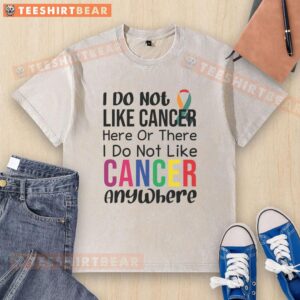 Motivational anti-cancer quote on a washed t-shirt, promoting awareness and positivity against cancer struggles.