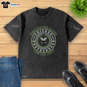 Alt Text: Top Through The Clouds I See The Light Chicago Brotherhood washed t-shirt featuring a vibrant graphic design.