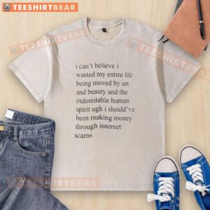 Alt Text: Awesome 'I Can't Believe I Wasted My Entire Life' washed T-shirt displayed on a wooden background.