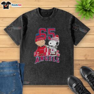 Alt Text: Cute Charlie Brown and Snoopy on a Los Angeles Angels 65th Anniversary t-shirt featuring the city skyline design.