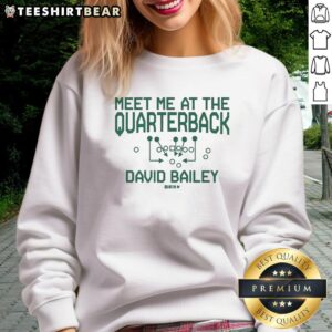 Alt Text: Stylish Pretty David Bailey 'Meet Me At The Quarterback' sweatshirt featuring trendy design and vibrant colors.