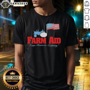 Alt Text: Original Farm Aid Keep America Growing tractor and American flag T-shirt design, promoting sustainable farming.