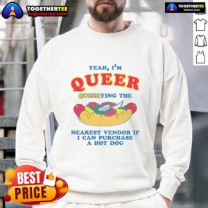 Person in a sweatshirt asking a vendor about hot dogs, showcasing queer pride with a 'Nice Yeah I'm Queer' design.
