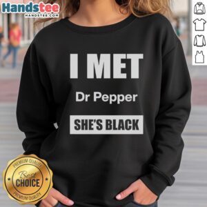 Alt Text: Woman wearing a black sweatshirt with 'Top I Met Dr. Pepper' text, showcasing a stylish and trendy look.