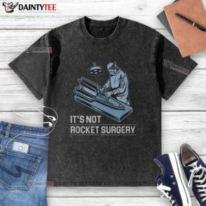 Alt Text: Funny It's Not Rocket Surgery washed t-shirt showcasing a humorous design perfect for casual wear.