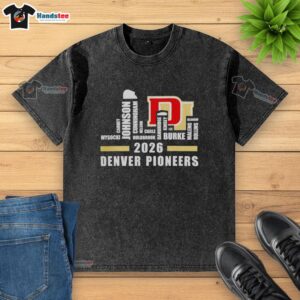 Alt Text: Premium Denver Pioneers Hockey Champions 2026 Roster Names shirt with city skyline design, showcasing team pride.