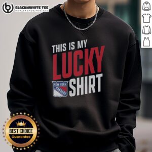 Fan wearing a New York Rangers sweatshirt, showcasing team spirit and luck during a game day celebration.