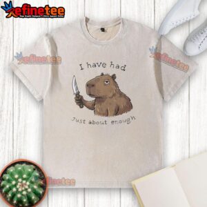 Alt Text: Capybara wearing a washed t-shirt with 'Just About Enough' text, showcasing a playful and trendy vibe.