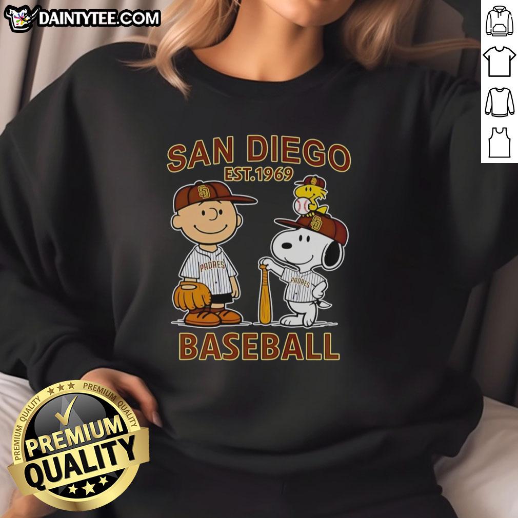 nice-charlie-brown-snoopy-and-woodstock-with-diego-padres-baseball-jersey-est-1969-sweatshirt Alt Text: Charlie Brown, Snoopy, and Woodstock wearing a Padres jersey on a cozy sweatshirt, perfect for fans of baseball and Peanuts.