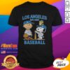 Charlie Brown, Snoopy, and Woodstock wearing a Los Angeles Dodgers baseball jersey T-shirt, established 1883.