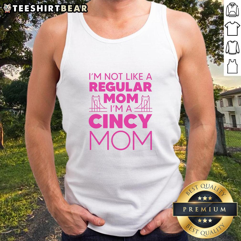 nice-im-not-like-a-regular-mom-tank-top Alt Text: Woman wearing 'Nice, I'm Not Like A Regular Mom' tank top, showcasing a fun and stylish mom outfit.