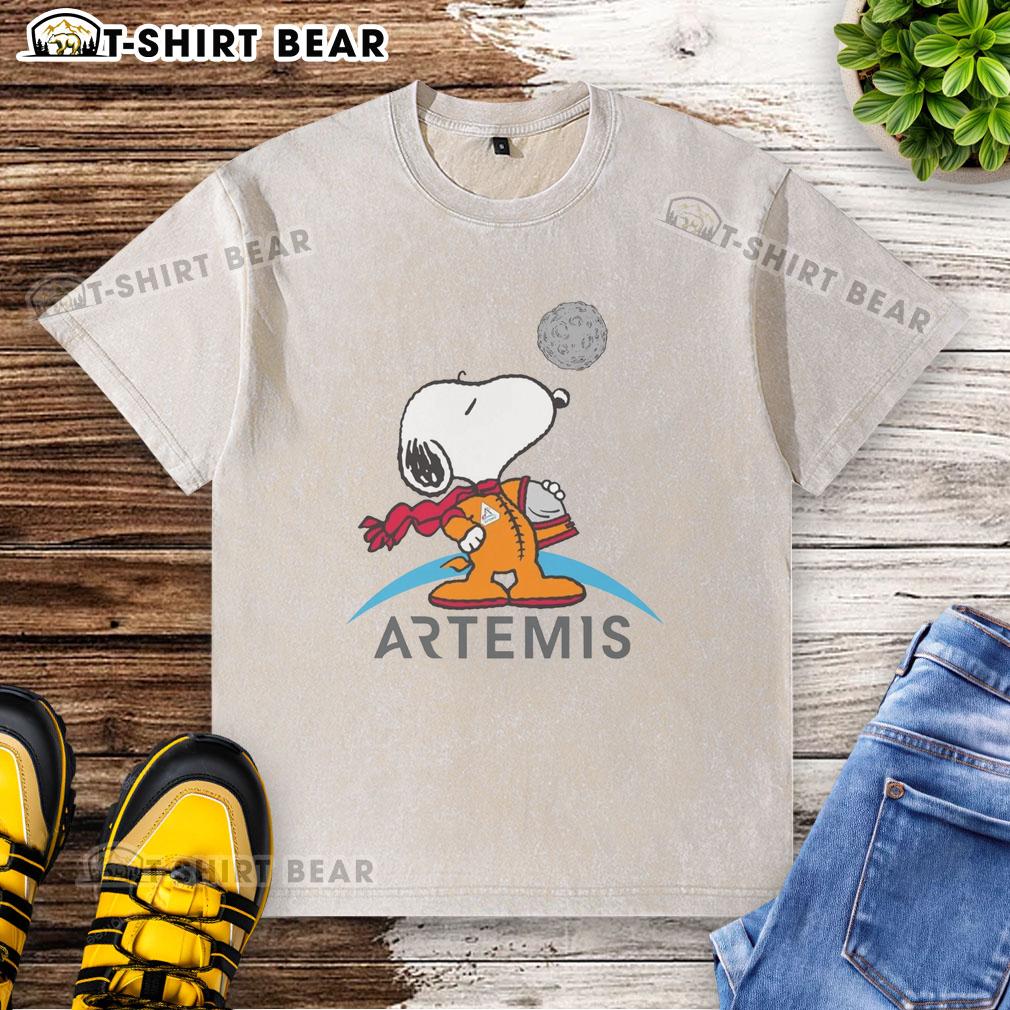 Nice Snoopy Artemis Astronaut Washed T Shirt Nice Snoopy Artemis astronaut washed t-shirt featuring a playful design of Snoopy in a space suit, perfect for fans.