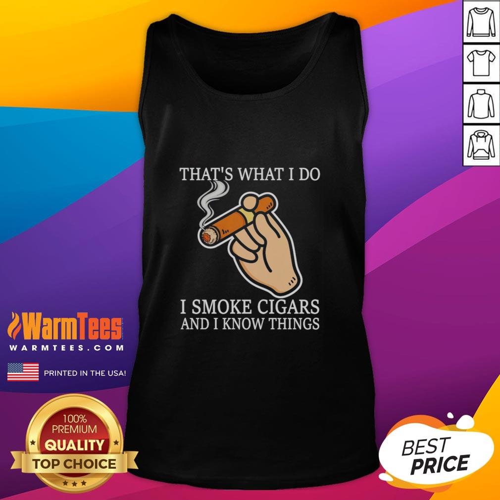 nice-thats-what-i-do-i-smoke-cigars-and-i-know-things-tank-top Person wearing a 'Nice, That's What I Do, I Smoke Cigars and I Know Things' tank top, showcasing a stylish casual look.