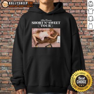 Sabrina Carpenter wearing the Original Short N Sweet Tour hoodie, showcasing stylish tour merchandise.