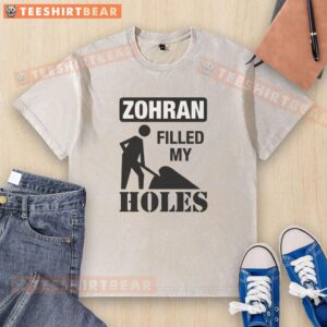 Awesome The Mayor Filled My Holes washed t-shirt displayed on a hanger, showcasing its vibrant colors and fun design.