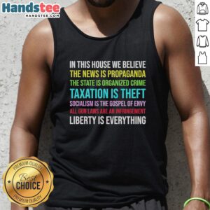 Alt Text: Libertarian version tank top with 'In This House We Believe' slogan, perfect for showing your values in style.