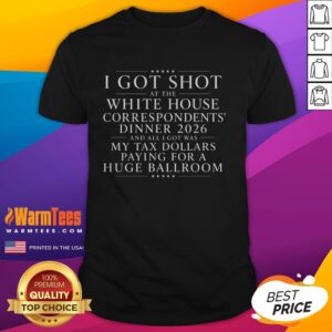 Funny 'I Got Shot At White House Dinner' T-shirt showcasing tax dollars humor in a large ballroom setting.