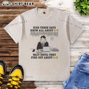 Alt Text: Good Kids These Days Know All About 6-7 - 9-5 Washed T-Shirt featuring a trendy design for modern youth fashion.