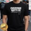 Alt Text: Official Everyone Hates Us T-Shirt featuring a city skyline design, perfect for urban style enthusiasts.