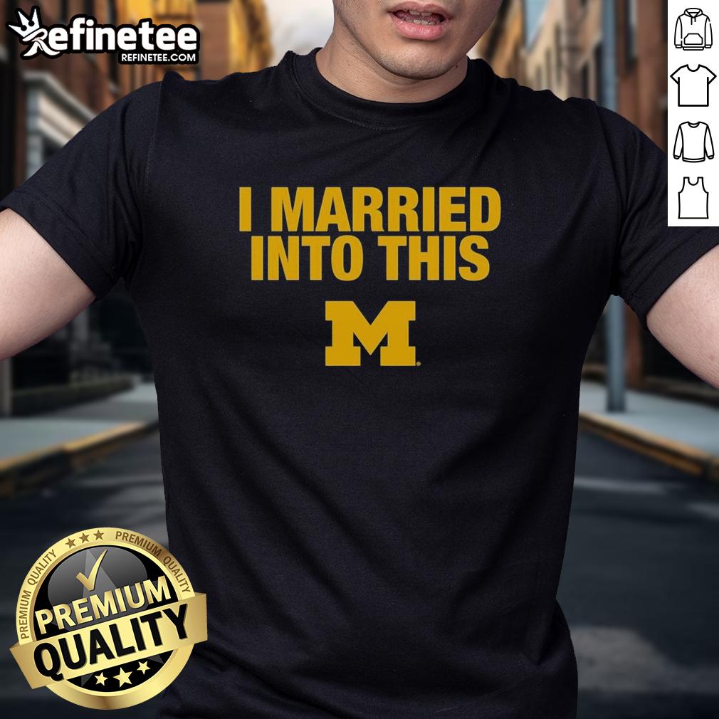 official-i-married-into-this-michigan-wolverines-t-shirt Alt Text: Official I Married Into This Michigan Wolverines T-Shirt featuring bold logo and vibrant colors for fans.