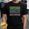 Alt Text: Official In This House We Believe Libertarian Version T-Shirt featuring bold text and a stylish design for libertarian supporters.