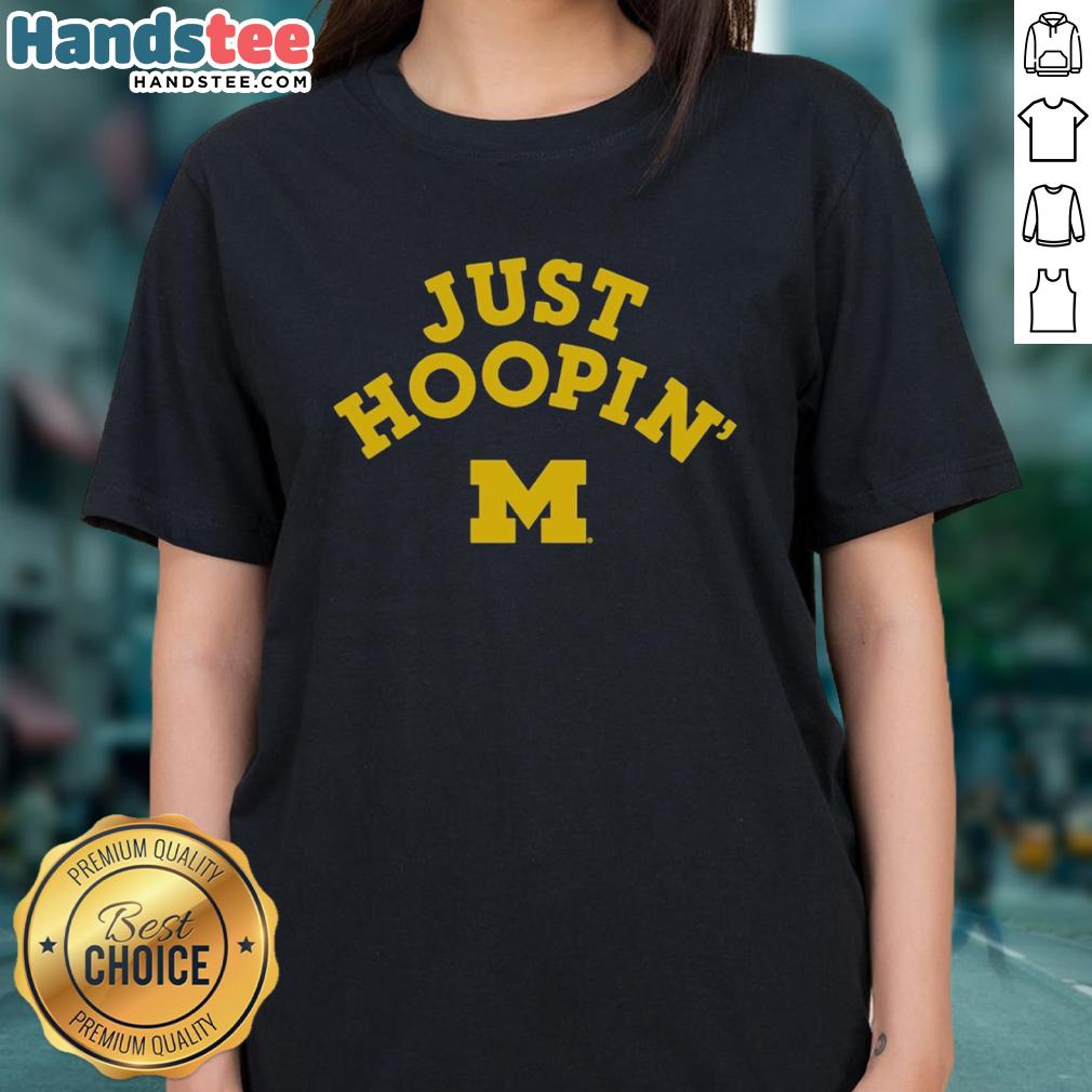 official-michigan-wolverines-just-hoopin-ladies-tee Alt Text: Official Michigan Wolverines Just Hoopin ladies tee in blue with logo, perfect for fans and casual wear.