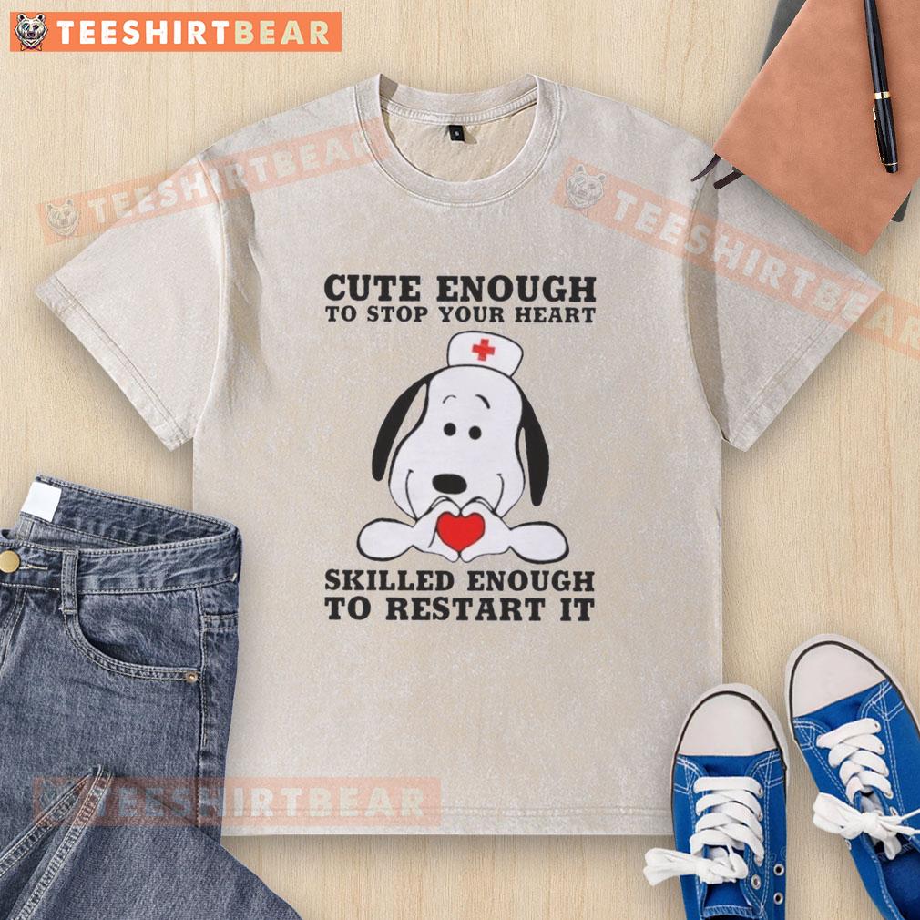 official-peanuts-snoopy-nurse-cute-enough-to-stop-your-heart-skilled-enough-to-restart-it-washed-t-shirt Alt Text: Cute Snoopy nurse graphic on a washed t-shirt, perfect for Peanuts fans who appreciate humor and heartwarming designs.