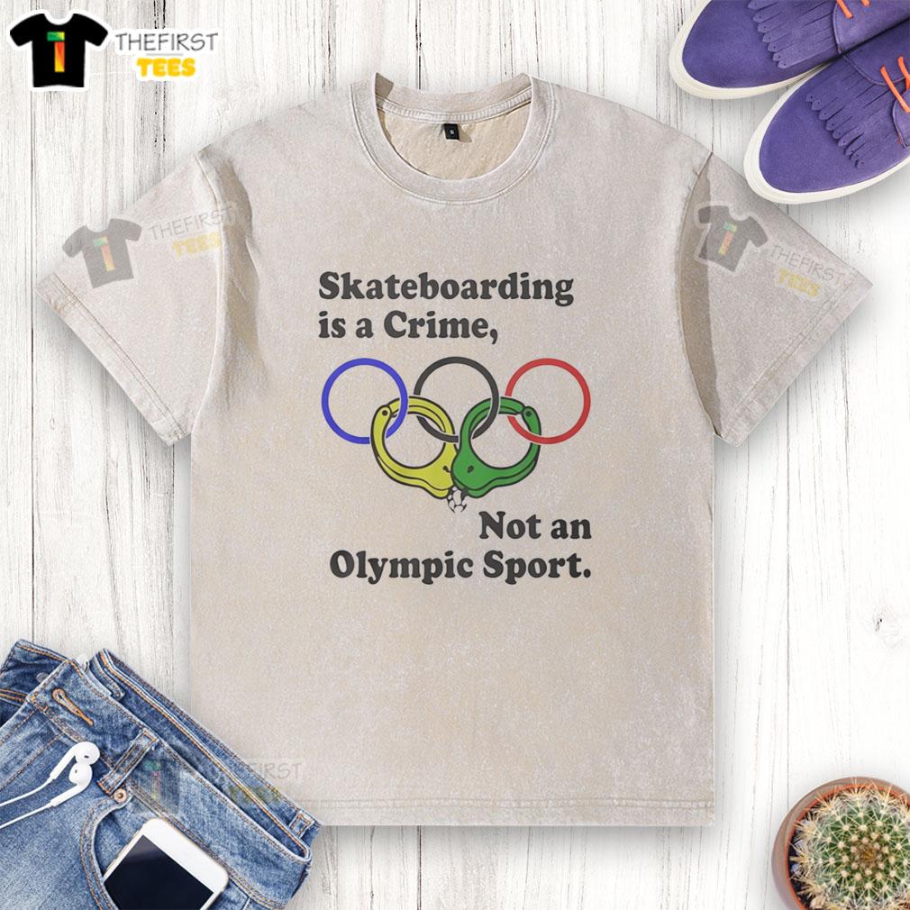 official-skateboarding-is-a-crime-not-an-olympic-sport-washed-t-shirt Official Skateboarding Is A Crime Not An Olympic Sport washed t-shirt in light blue, perfect for skate enthusiasts.