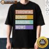 Alt Text: Retro 'Throwing Bombs Banging Moms' T-shirt design featuring bold typography and vibrant colors on a casual tee.