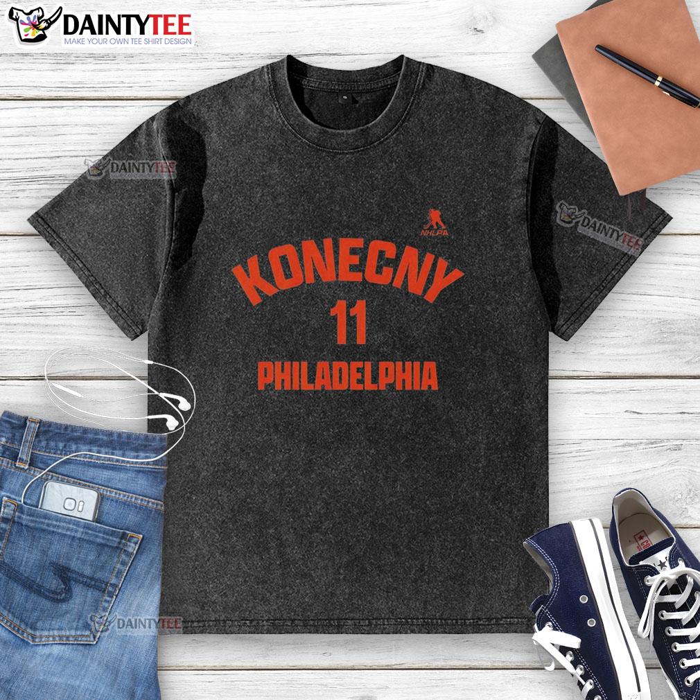 official-travis-konecny-11-philadelphia-flyers-washed-t-shirt Alt Text: Official Travis Konecny Philadelphia Flyers washed t-shirt showcasing team colors and player name on the back.