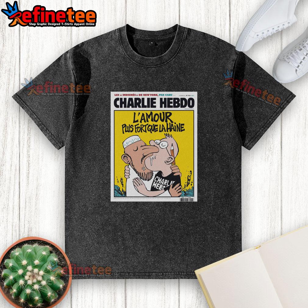 official-two-men-kissing-charlie-hebdo-lamour-plus-fort-que-la-haine-washed-t-shirt Alt Text: Official Charlie Hebdo 'L'Amour Plus Fort Que La Haine' washed t-shirt featuring two men kissing, promoting love and acceptance.