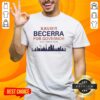 Official Xavier Becerra Governor 2026 California skyline t-shirt featuring iconic landmarks and vibrant colors.