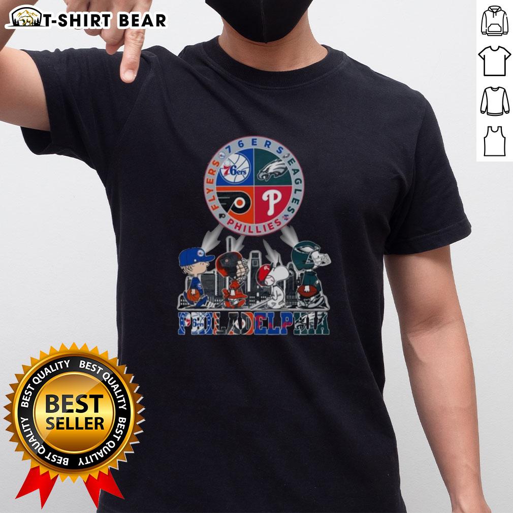 Original Philadelphia Sports Teams Snoopy 76Ers Eagles Flyers Phillies T Shirt Alt Text: Original Philadelphia Sports Teams Snoopy T-shirt featuring 76ers, Eagles, Flyers, and Phillies logo designs.